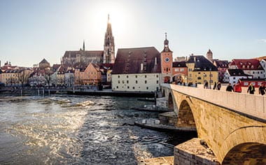 Regensburg at winter with the Cathedral and stone bridge, Germany Regensburg at winter with the Cathedral and stone bridge, Germany
